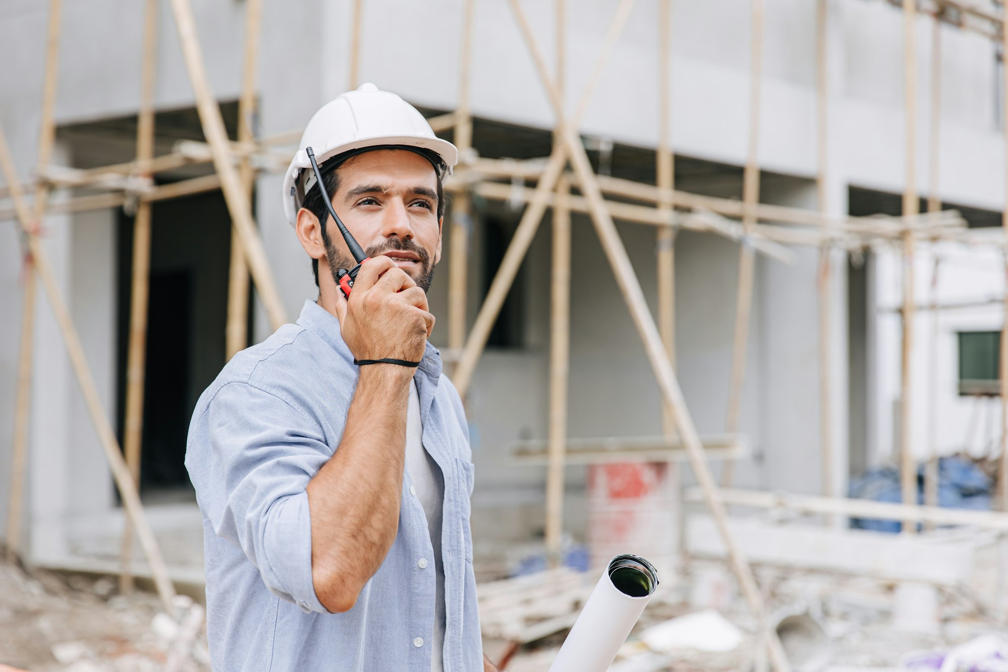 Hispanic latin indian builder work in construction site. Architect home project chief engineer